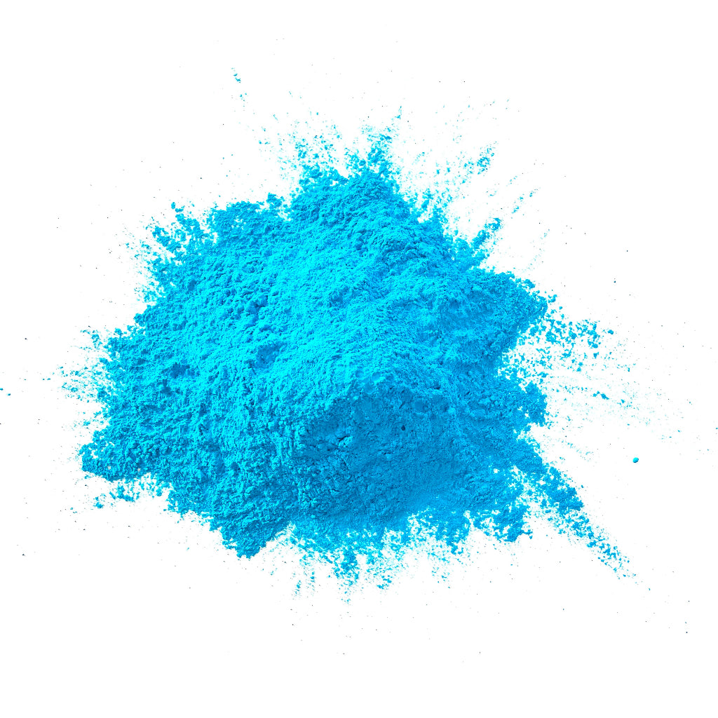 Blue colour powder in a heap on a white background.